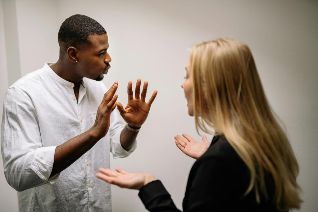 man and woman yelling