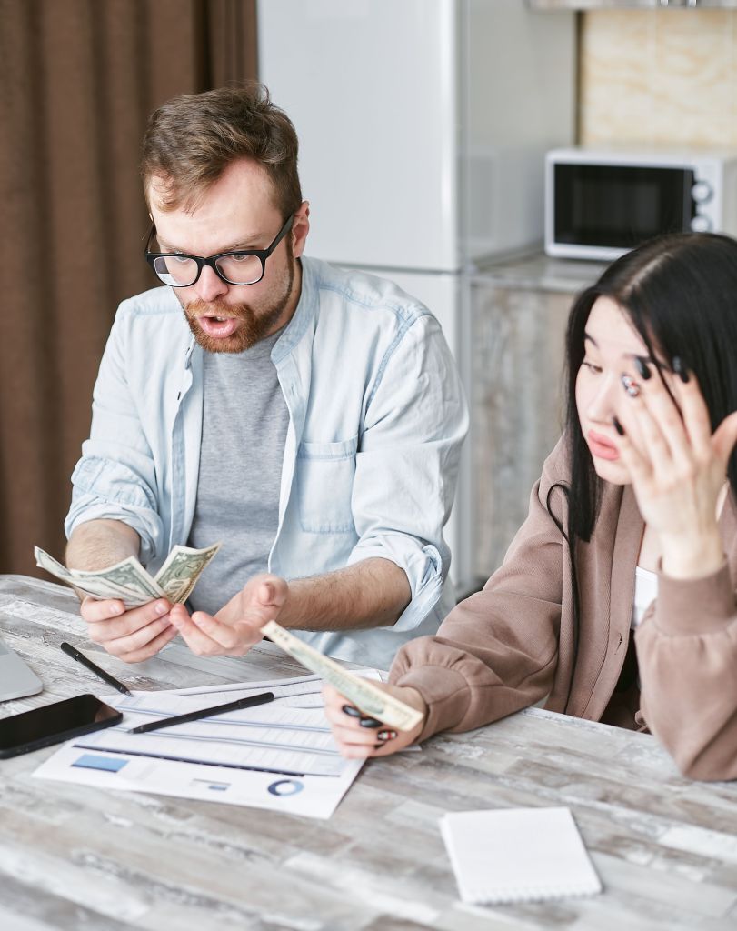 A couple (man and woman) review finances